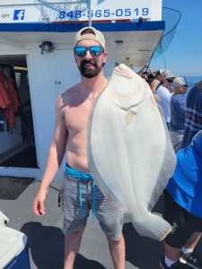 a man holding a fish