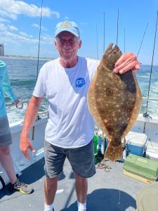 a man holding a fish