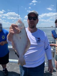 a man holding a fish