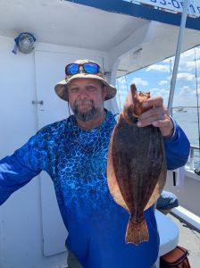 a man holding a fish