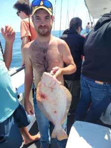 a person holding a fish