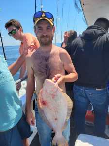 a person holding a fish