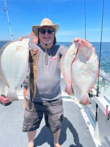 a man holding a fish