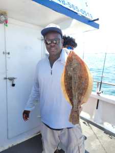 a man holding a fish