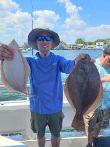 a man holding a fish