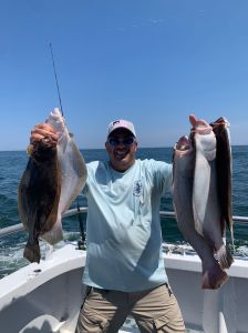 a person holding a fish