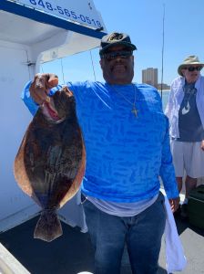 a person holding a fish