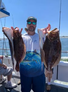 a man holding a fish