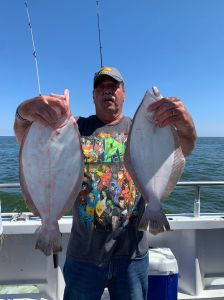 a person holding a fish