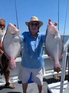 a man holding a fish