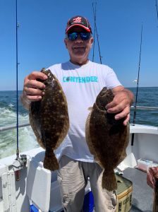 a man holding a fish