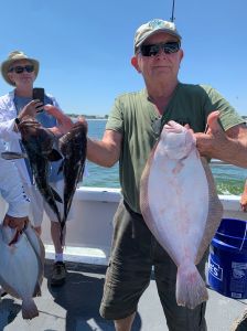 a person holding a fish