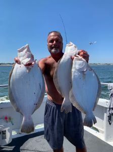 a man holding a fish