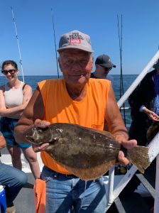 a man holding a fish in the water