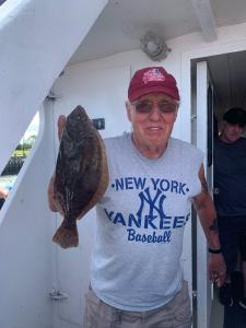 a man holding a fish