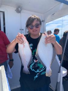 a person holding a fish