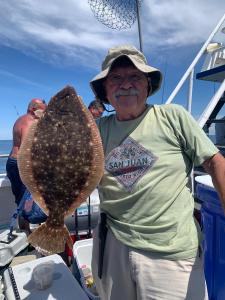 a man holding a fish