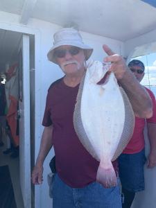 a person holding a fish