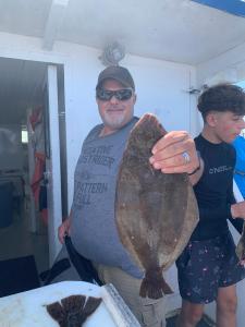 a man holding a fish