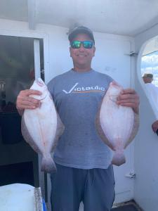 a man holding a fish