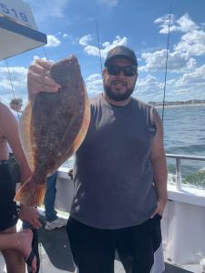 a man holding a fish