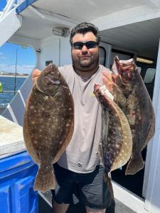 a man holding a fish