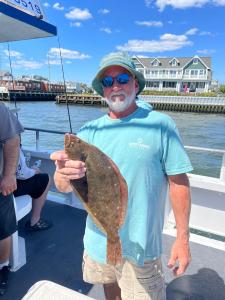 a man holding a fish