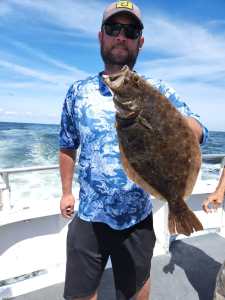 a man holding a fish