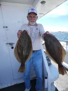 a man holding a fish in the water