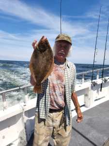 a man holding a fish