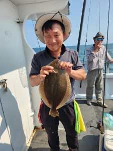 a man holding a fish