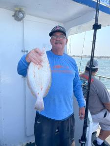 a man holding a fish