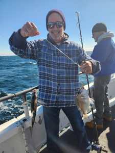 a man holding a fish