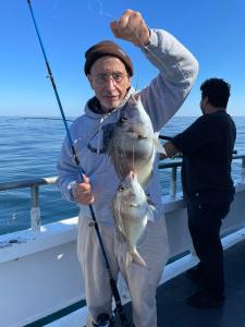 Tomasz Stańko holding a fish in the water