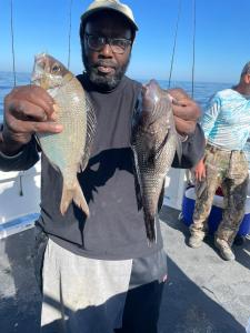 a man holding a fish