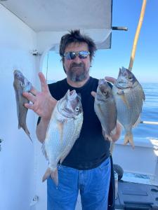 a man holding a fish