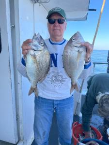 a man holding a fish