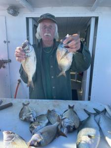 a man holding a fish