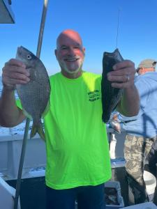 a man holding a fish