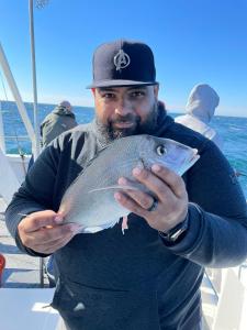 a man holding a fish