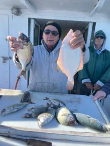 a person holding a fish