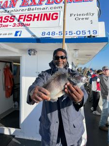 a man holding a fish