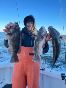 a man holding a fish