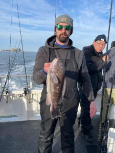 a man holding a fish