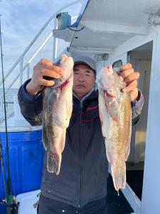 a man holding a fish