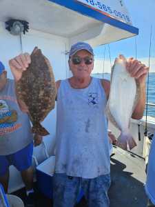 a man holding a fish