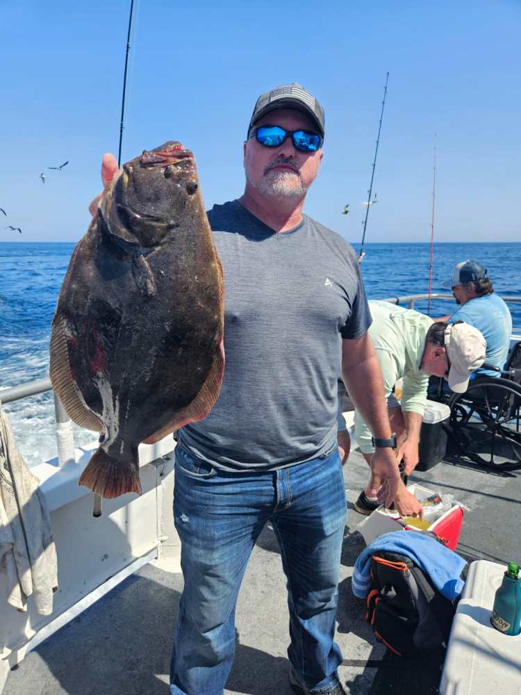 a man holding a fish