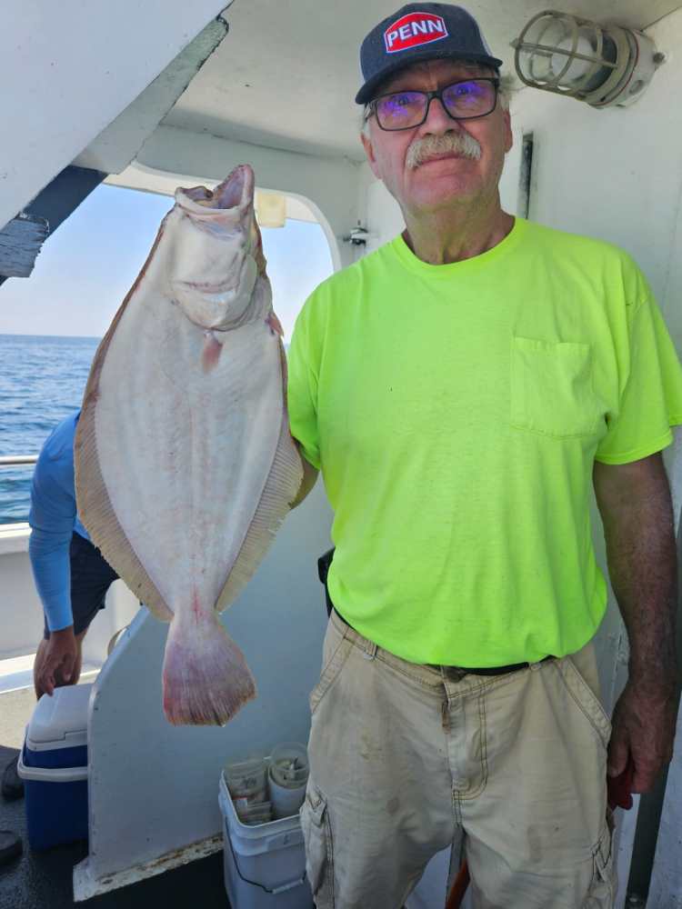 a man holding a fish