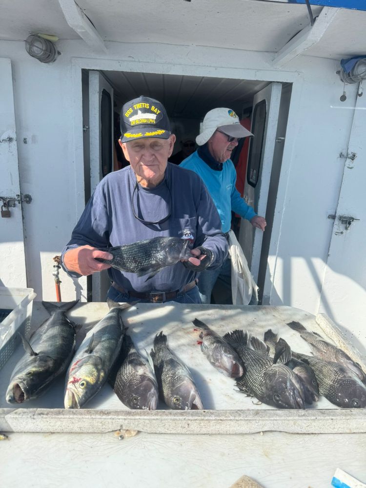 a man holding a fish