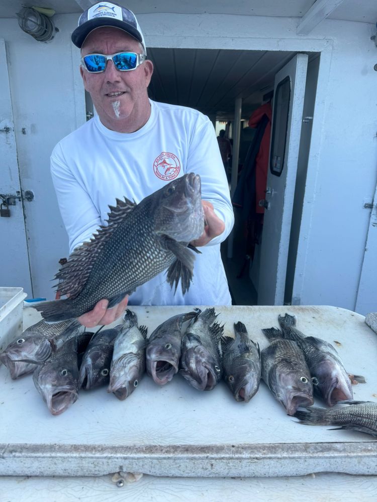 a man holding a fish